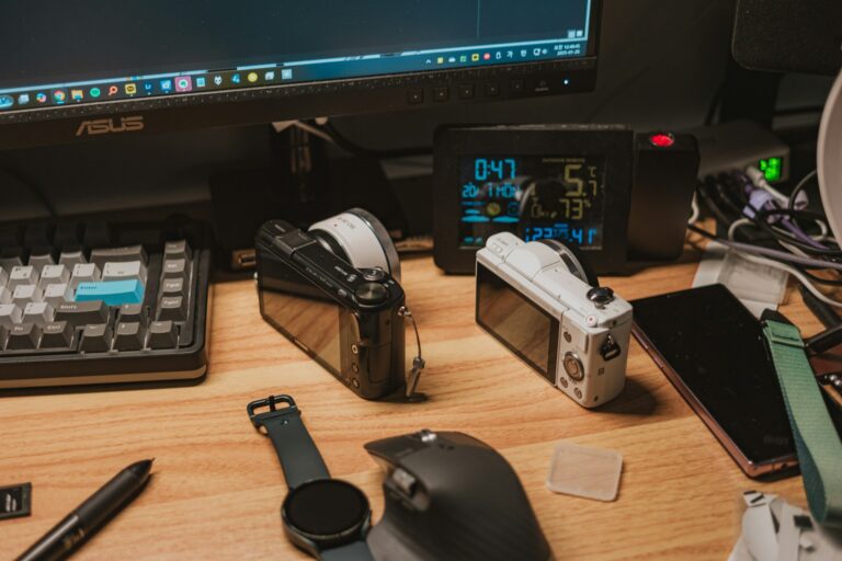 Latest Tech Gadgets 2025: The Categories Actually Worth Your Attention Desk with the latest tech gadgets 2025 including cameras, smartwatch and phone