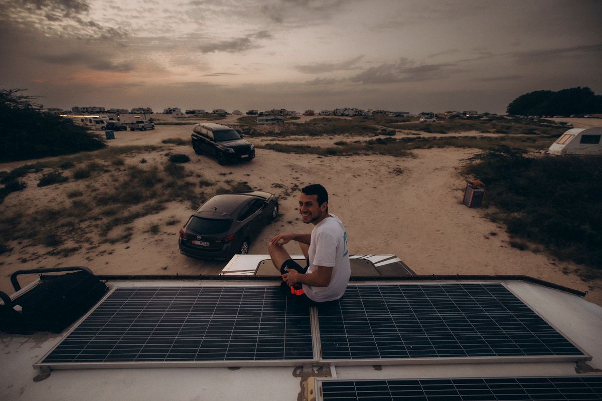 Cool camping gadgets - portable power station and solar panel at campsite