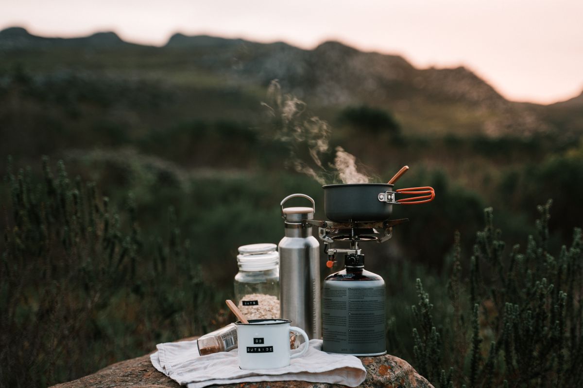 Cool camping gadgets - camp cooking stove with cookware outdoors