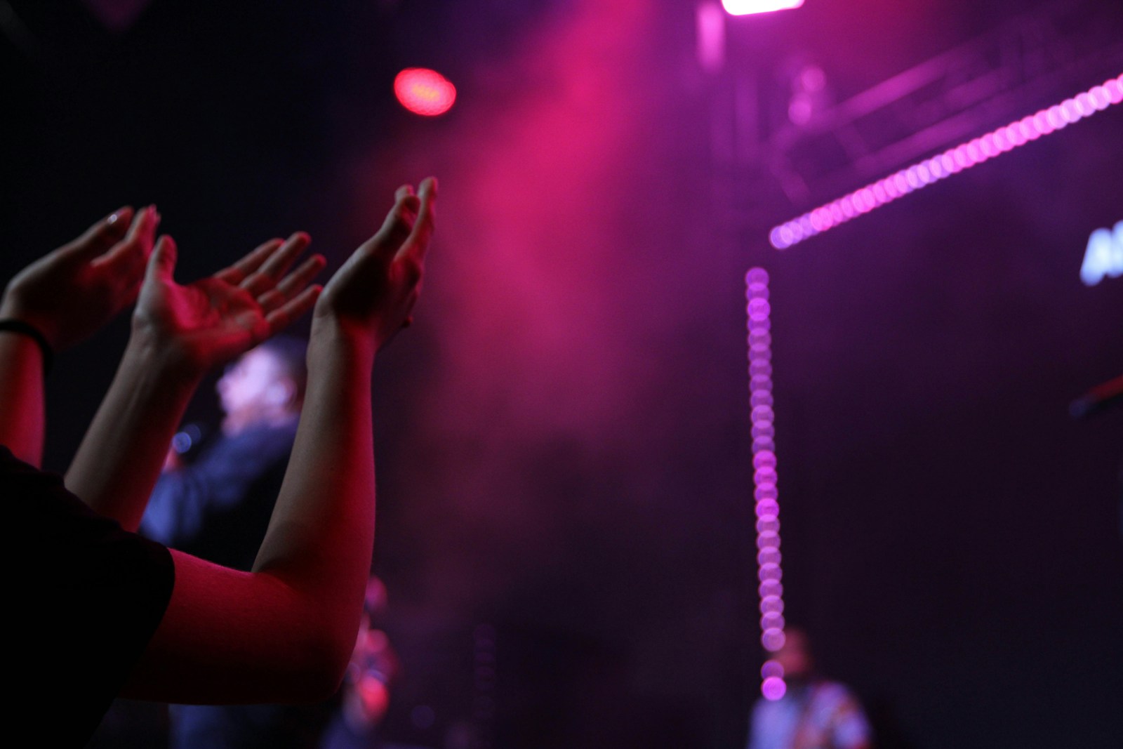 Jireh lyrics - hands raised in worship at a concert