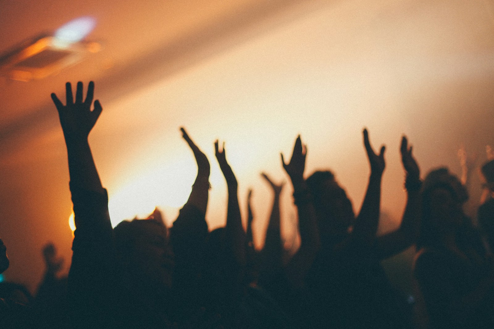 New Thing Coming lyrics - concert crowd with raised arms in worship