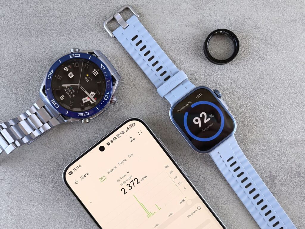 wellness gadgets smart ring and fitness tracker on desk